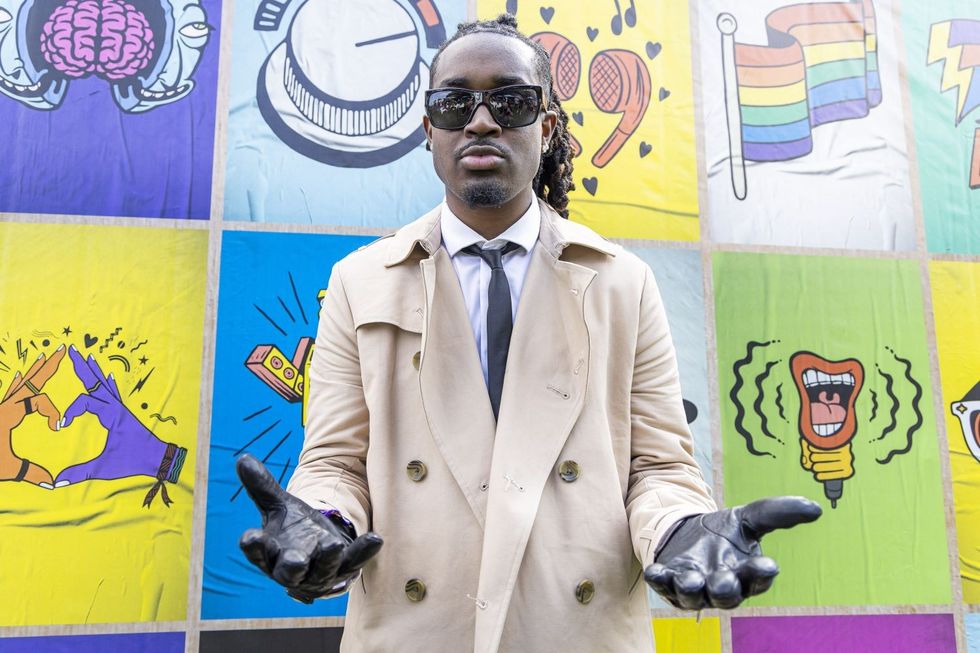 Rapper Cochise poses backstage on day 3 of Lollapalooza at Grant Park on July 30, 2022 in Chicago, Illinois.